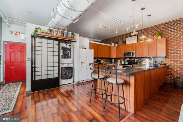 a view of a kitchen with furniture and a fireplace