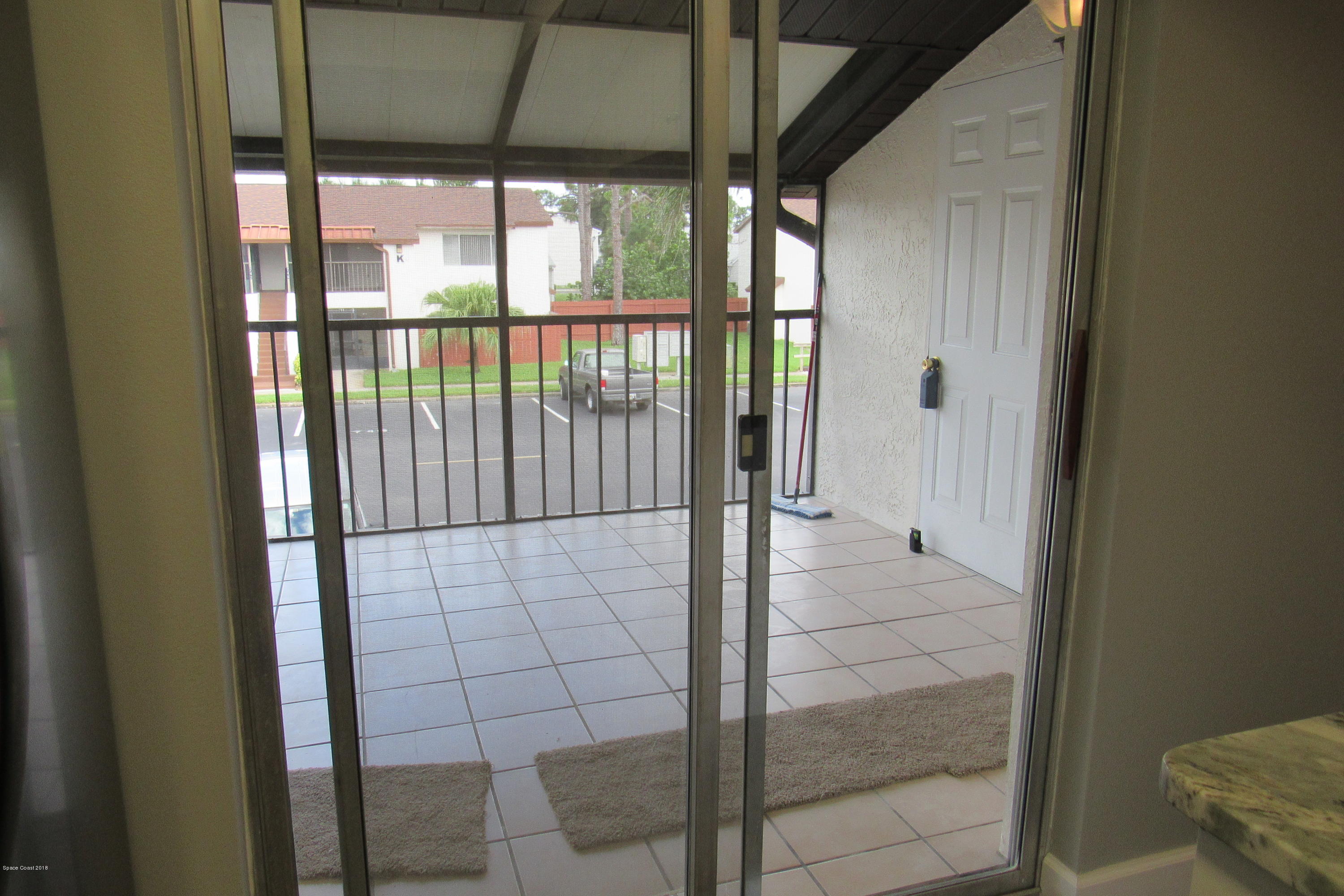 737 Ridge Club Drive, Unit 70 Melbourne, FL 32934 - Photo 8 of 20 SLIDERS TO PORCH