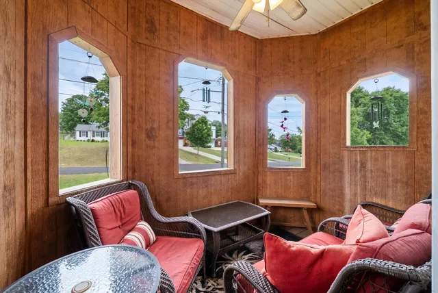 a bedroom with furniture and a window