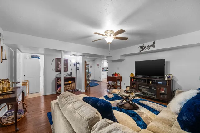 a living room with furniture and a flat screen tv