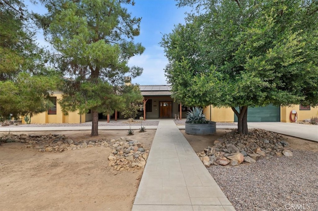 16420 Rocky Glen Road Perris, CA 92570 - Photo 10 of 74 a front view of a house with a yard