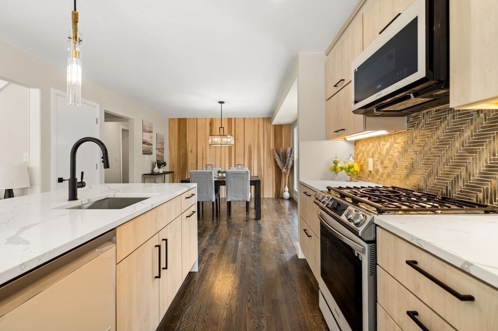 84 School Street Melrose, MA 02176 - Photo 12 of 34 a kitchen with a stove and a sink