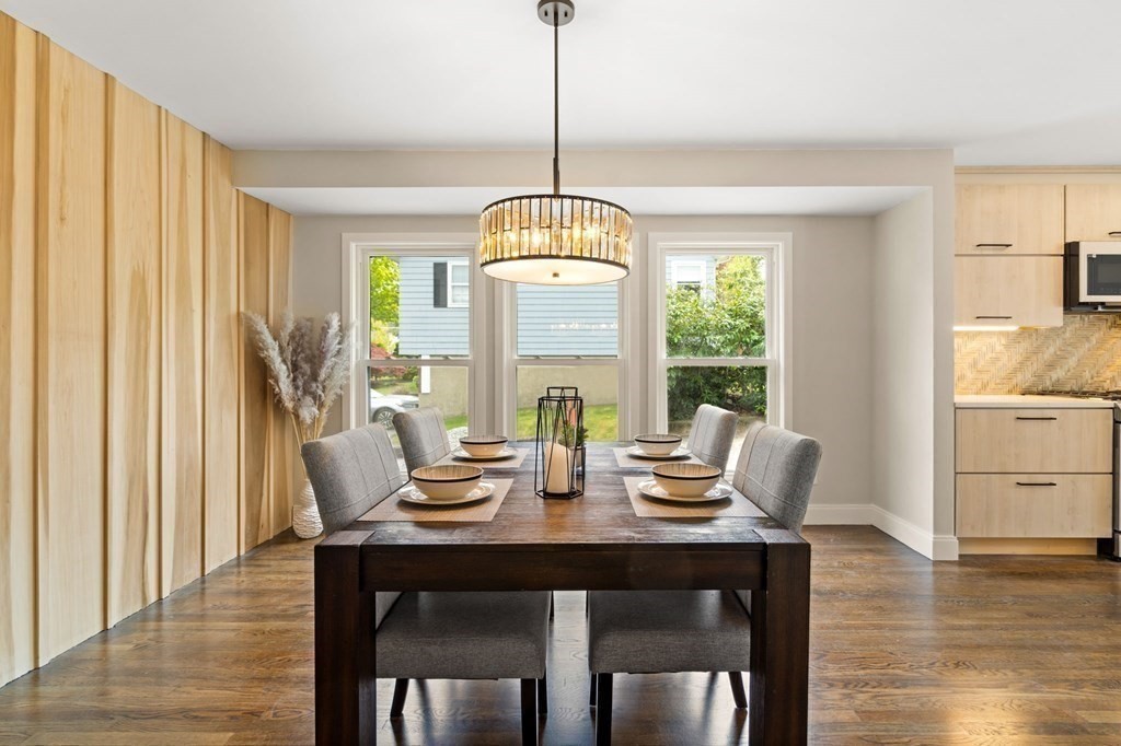 84 School Street Melrose, MA 02176 - Photo 15 of 34 a view of a dining room with furniture window and wooden floor