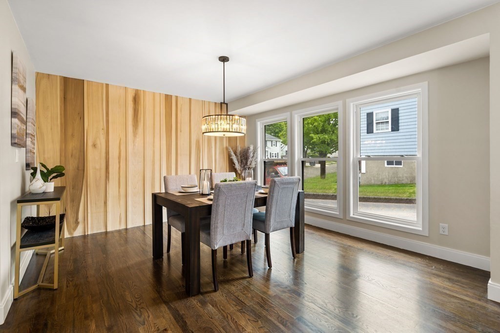 84 School Street Melrose, MA 02176 - Photo 17 of 34 a view of a dining room with furniture window and wooden floor