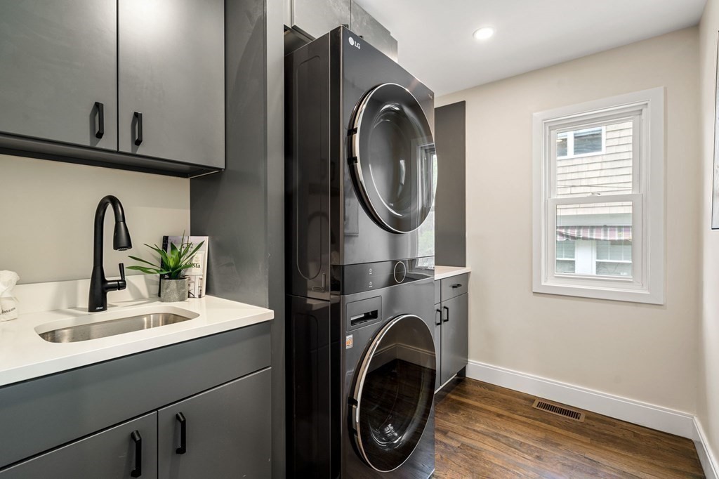 84 School Street Melrose, MA 02176 - Photo 20 of 34 a bathroom with a sink a washer and dryer