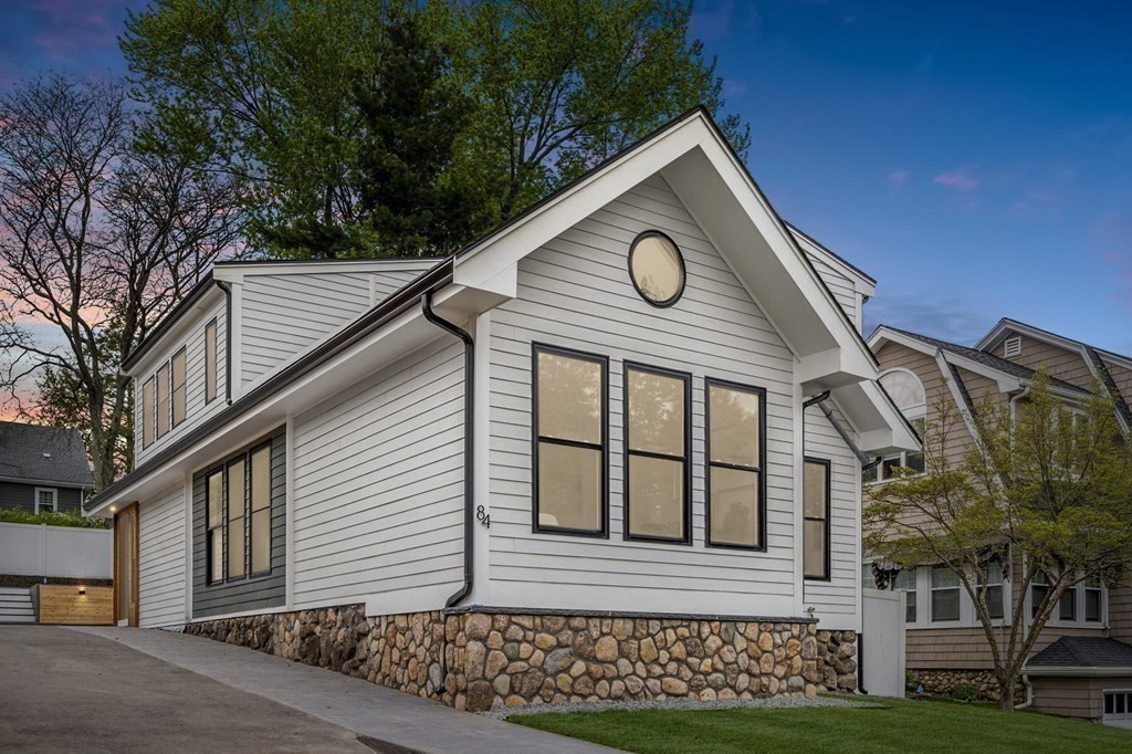84 School Street Melrose, MA 02176 - Photo 2 of 34 a front view of a house with a garden