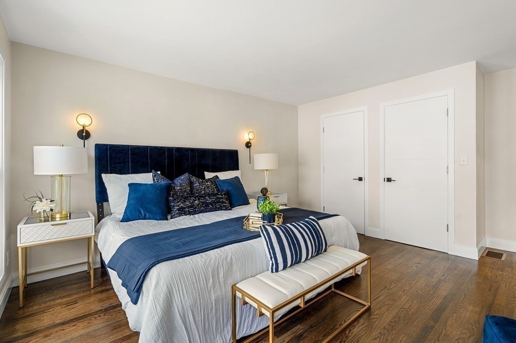 84 School Street Melrose, MA 02176 - Photo 24 of 34 a bed room with a bed and a night stand