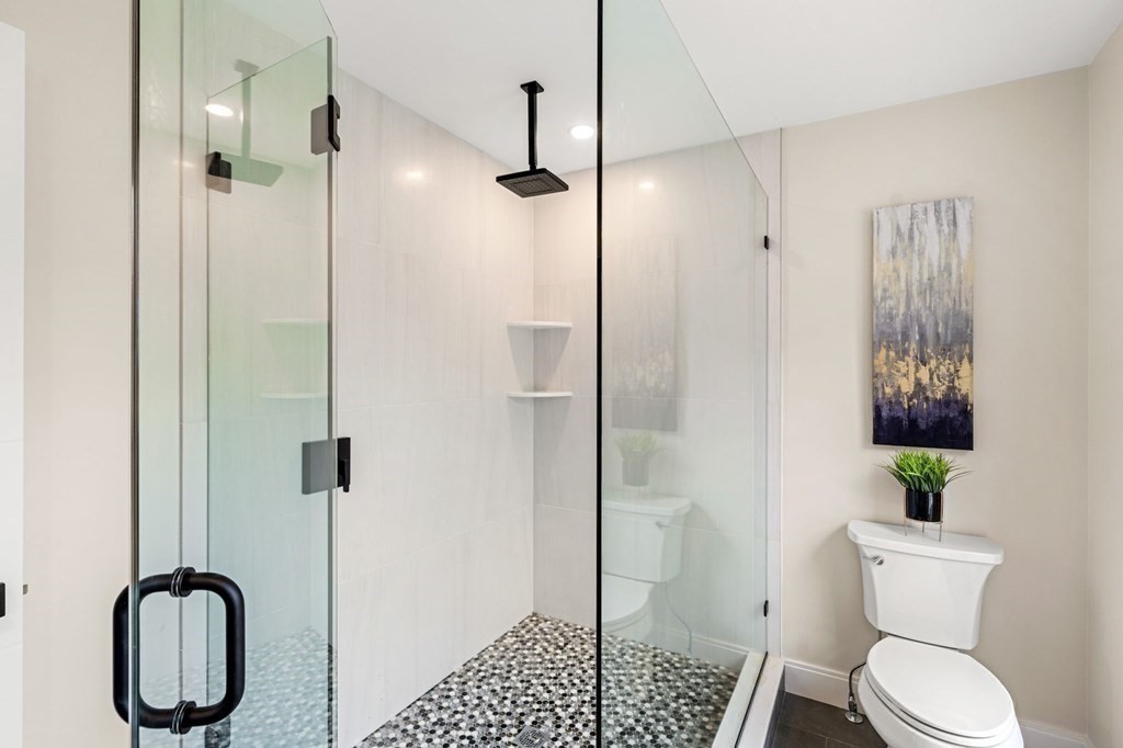 84 School Street Melrose, MA 02176 - Photo 26 of 34 a bathroom with a shower toilet and sink