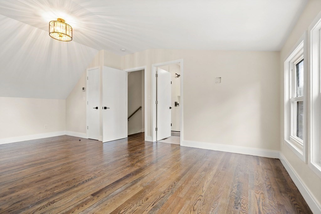 84 School Street Melrose, MA 02176 - Photo 28 of 34 a view of an empty room with wooden floor and a window