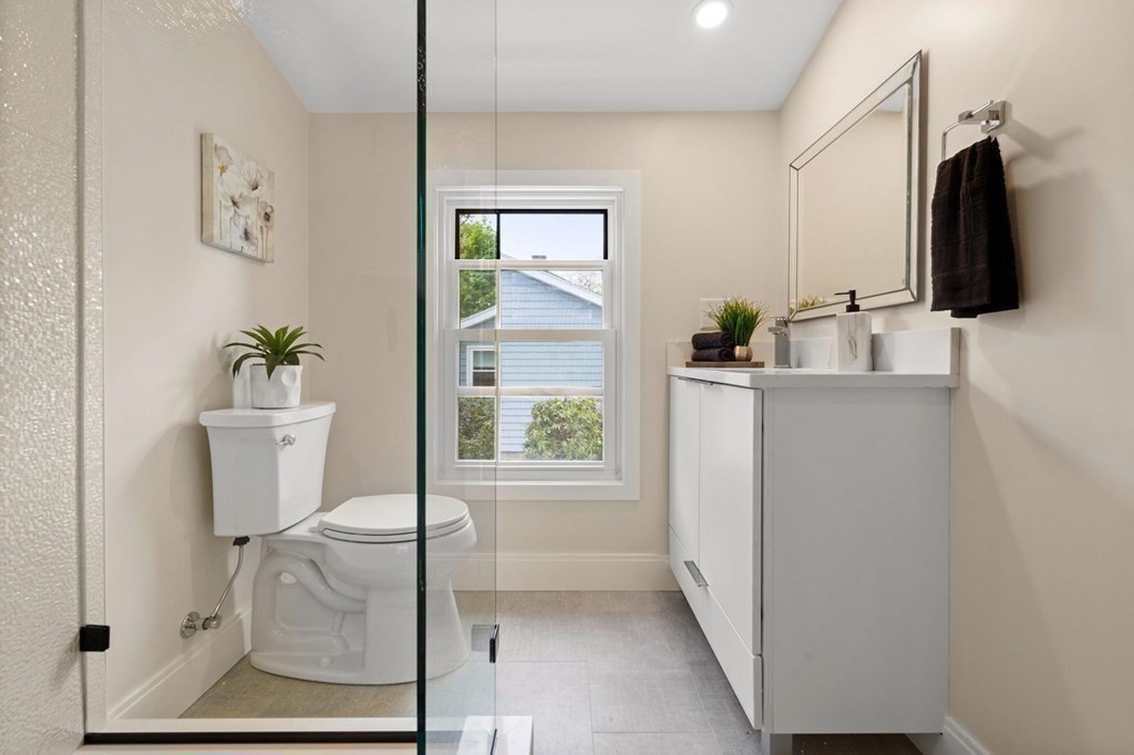 84 School Street Melrose, MA 02176 - Photo 30 of 34 a bathroom with a bathtub sink and toilet