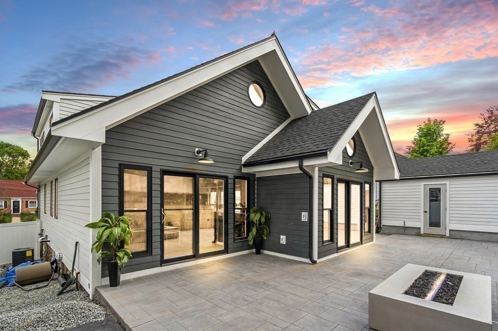 84 School Street Melrose, MA 02176 - Photo 3 of 34 a front view of a house with garden