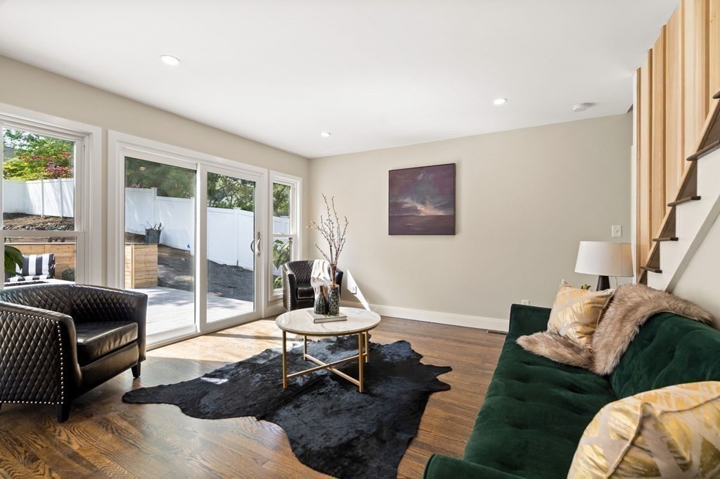 84 School Street Melrose, MA 02176 - Photo 6 of 34 a living room with furniture a rug and a large window