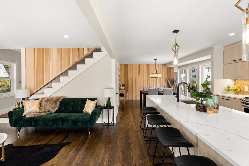 84 School Street Melrose, MA 02176 - Photo 9 of 34 a living room with furniture kitchen view and a wooden floor
