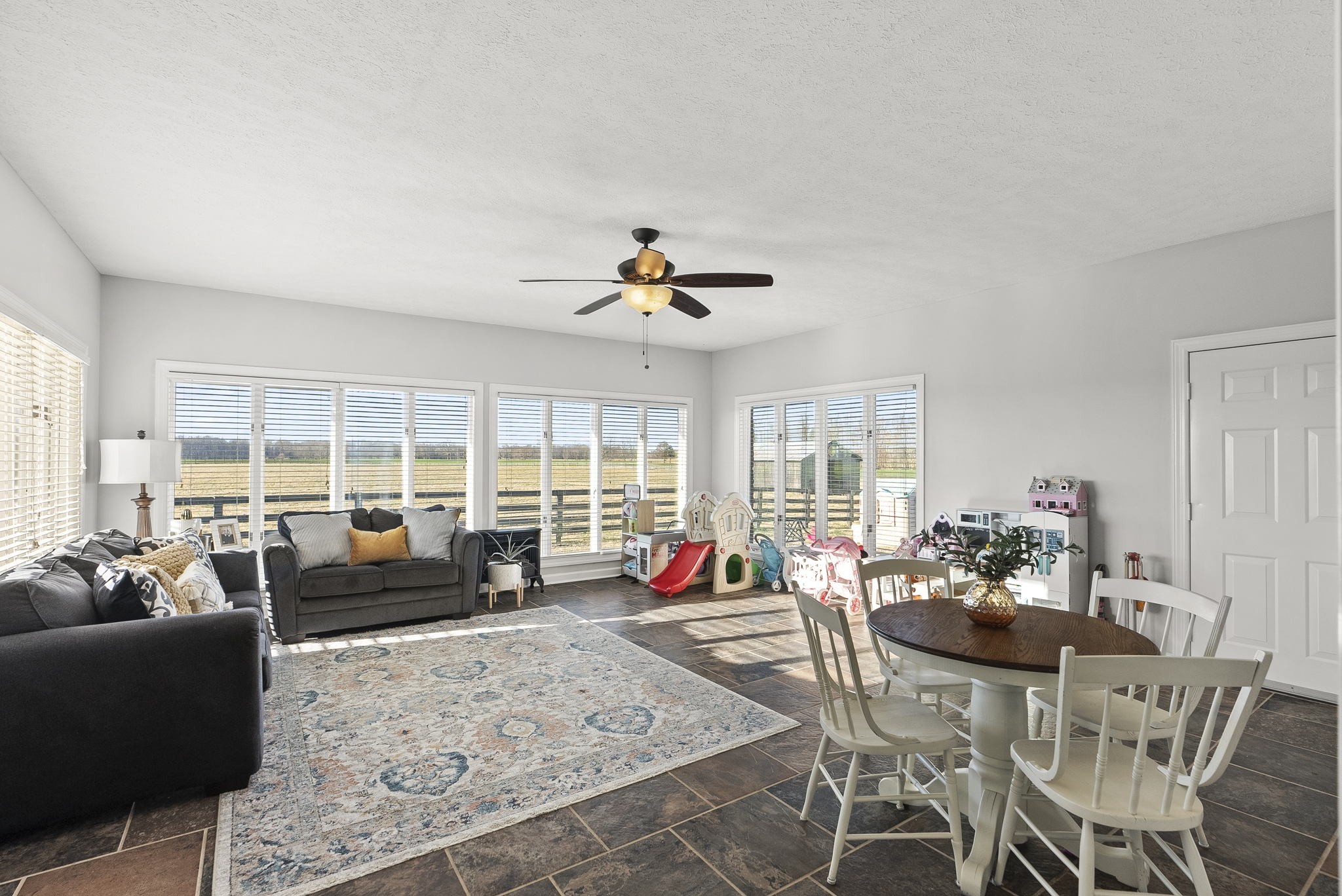 4767 Barren Plains Road Springfield, TN 37172 - Photo 24 of 68 a living room with furniture large windows and wooden floor