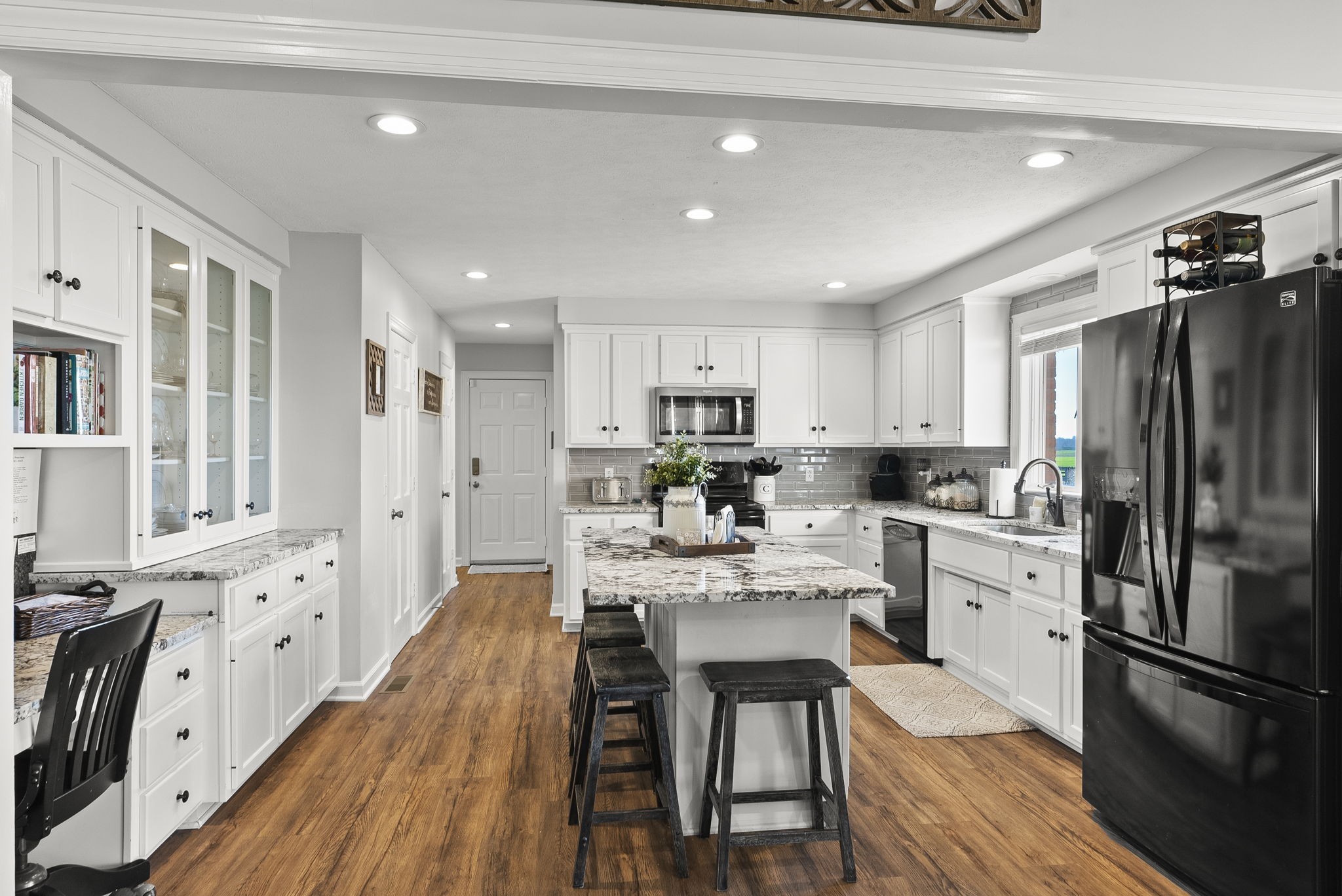 4767 Barren Plains Road Springfield, TN 37172 - Photo 26 of 68 a kitchen with white cabinets and stainless steel appliances