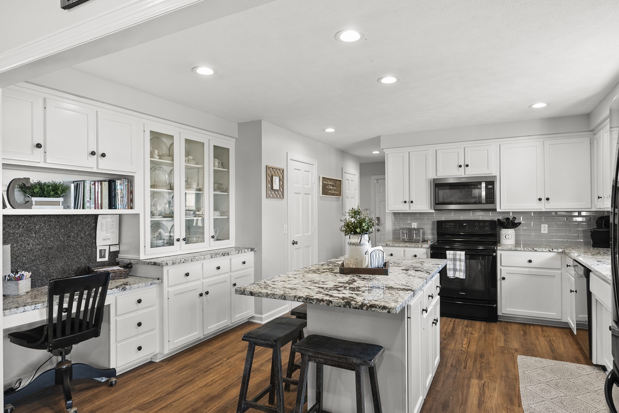 4767 Barren Plains Road Springfield, TN 37172 - Photo 27 of 68 a kitchen with granite countertop white cabinets and stainless steel appliances