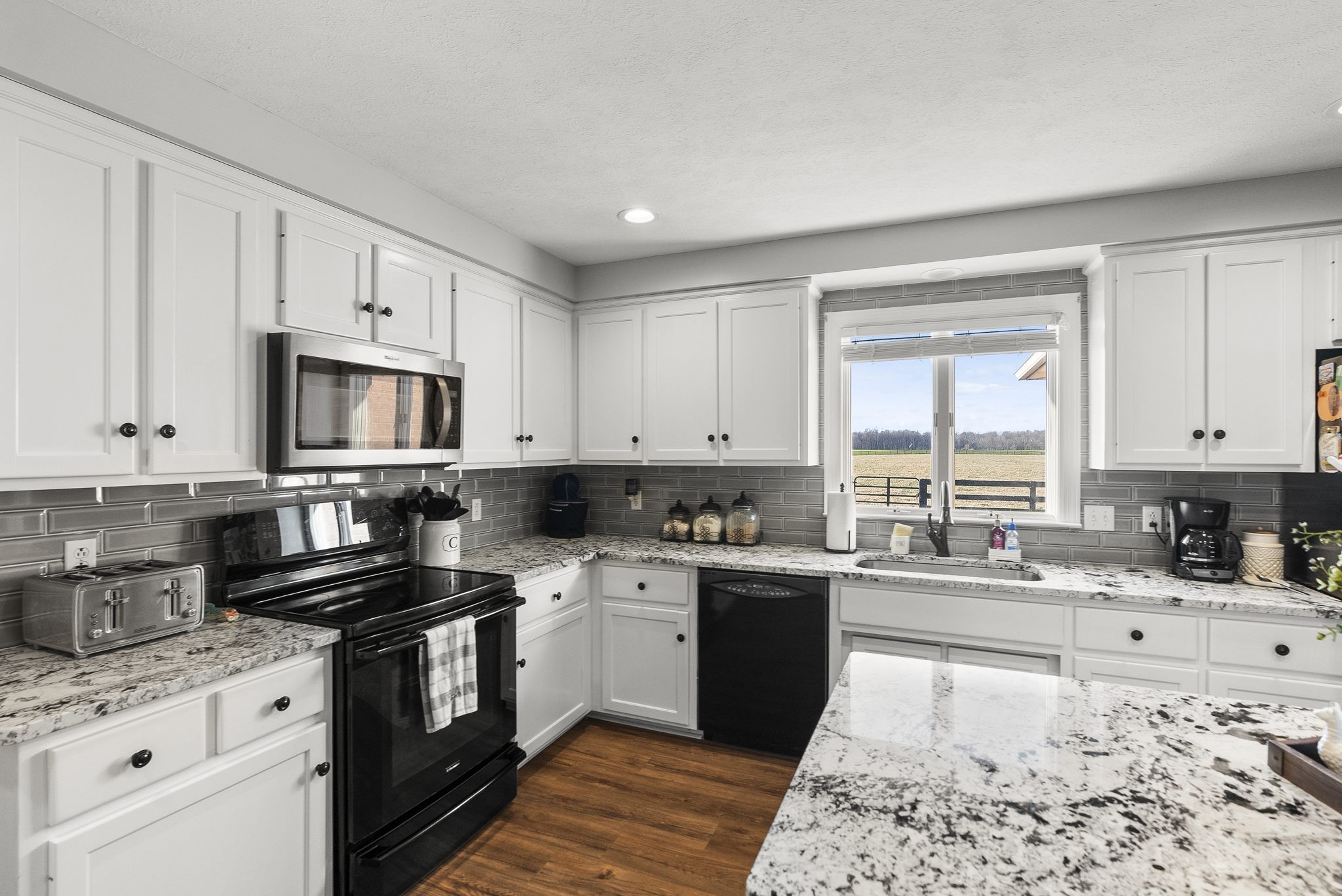4767 Barren Plains Road Springfield, TN 37172 - Photo 31 of 68 a kitchen with a sink stove top oven and refrigerator