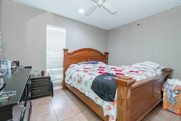 a bedroom with a bed and a table