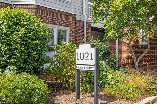 a sign that is on a brick wall