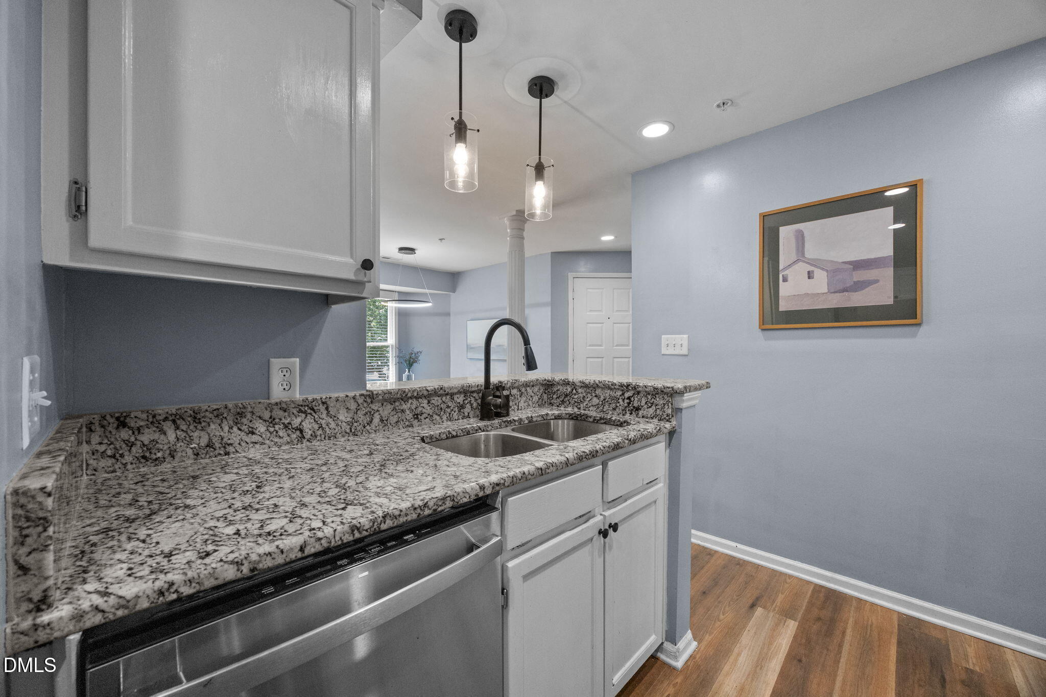 1021 Brighthurst Drive, Unit 103 Raleigh, NC 27605 - Photo 16 of 27 a kitchen with a sink and cabinets