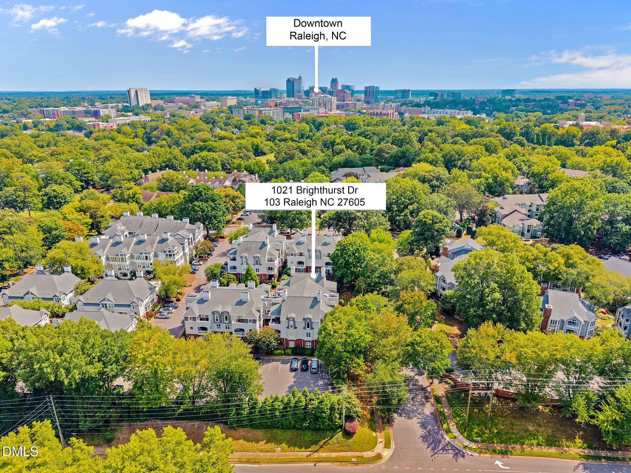 1021 Brighthurst Drive, Unit 103 Raleigh, NC 27605 - Photo 24 of 27 a view of a lake with a building in the background