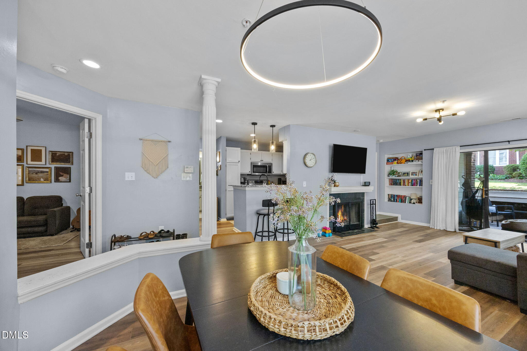 1021 Brighthurst Drive, Unit 103 Raleigh, NC 27605 - Photo 5 of 27 a living room with fireplace furniture and a flat screen tv