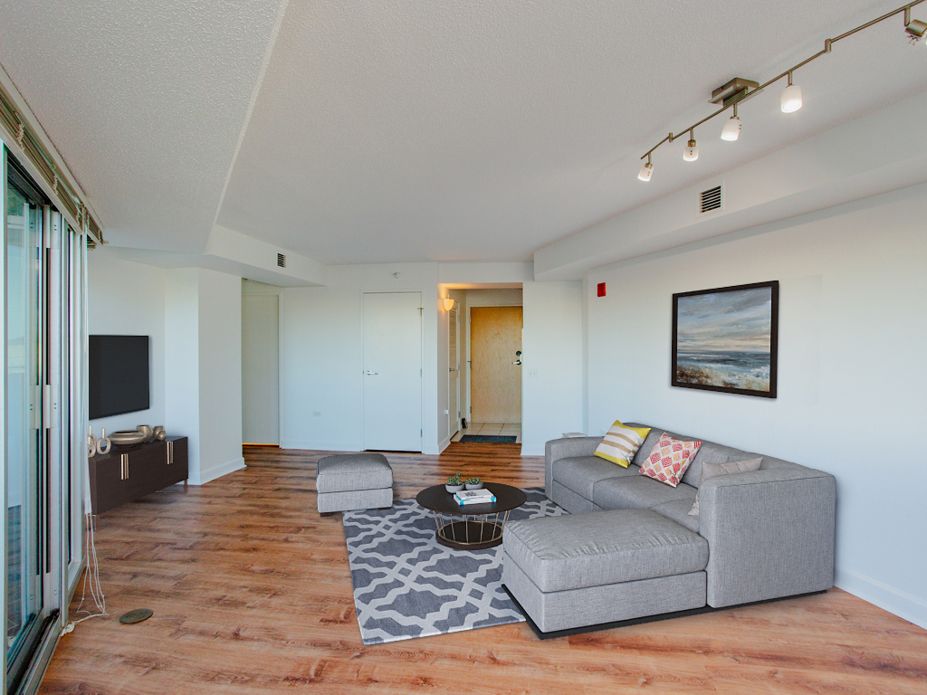 1720 Maple Avenue, Unit 660 Evanston, IL 60201 - Photo 3 of 16 a living room with furniture and a flat screen tv