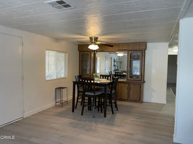 a view of a dining room with furniture