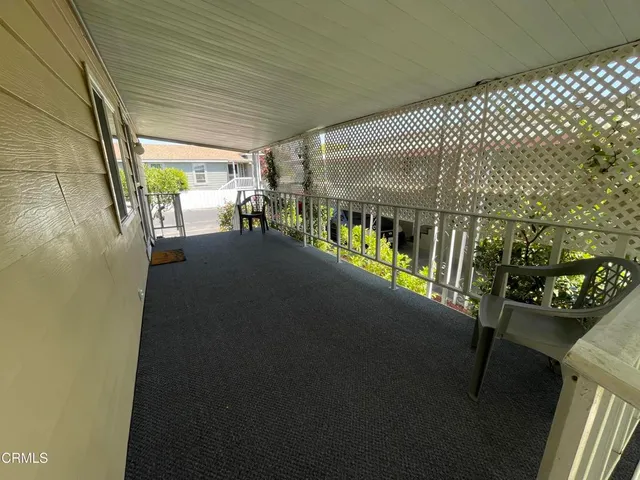 a view of a porch with furniture