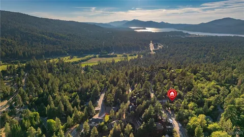 a view of a houses with a yard