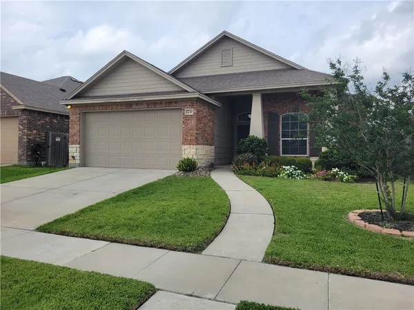 front view of a house with a yard