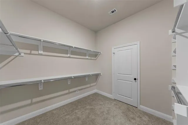 a view of an empty walk in closet