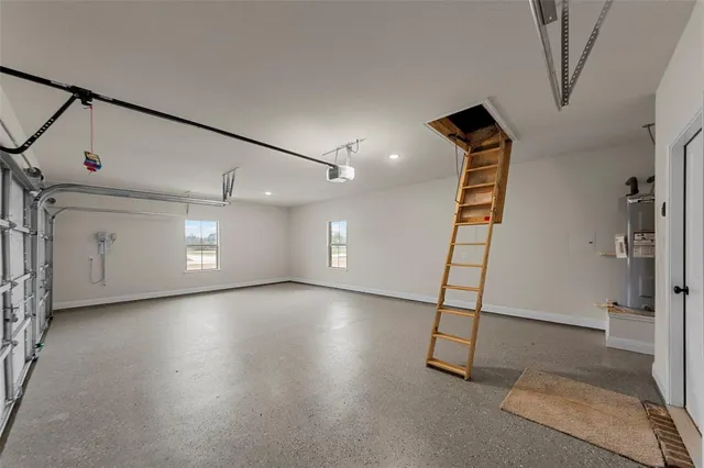a view of a livingroom with wooden floor and a ceiling fan