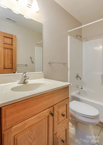 a bathroom with a sink a toilet and a bathtub
