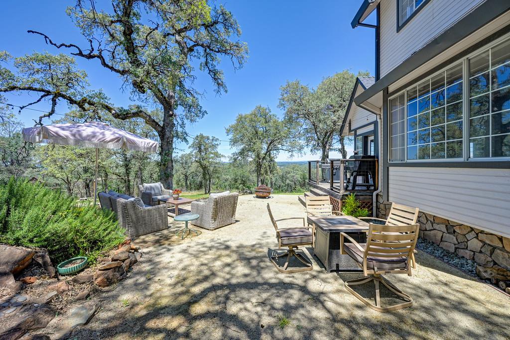 3154 Twin K Road Pilot Hill, CA 95664 - Photo 73 of 89 a view of a patio with a table and chairs and couches