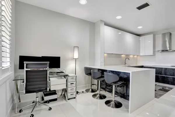a kitchen with a sink cabinets and window