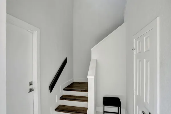 a view of entryway with wooden floor
