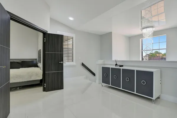 a spacious bathroom with a double vanity sink and a mirror