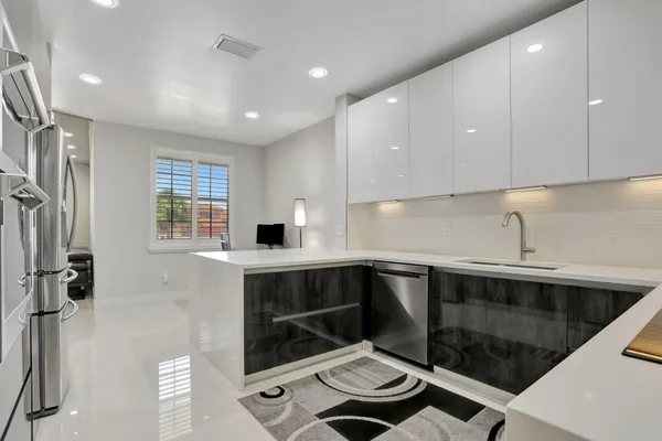 a kitchen with a sink and cabinets