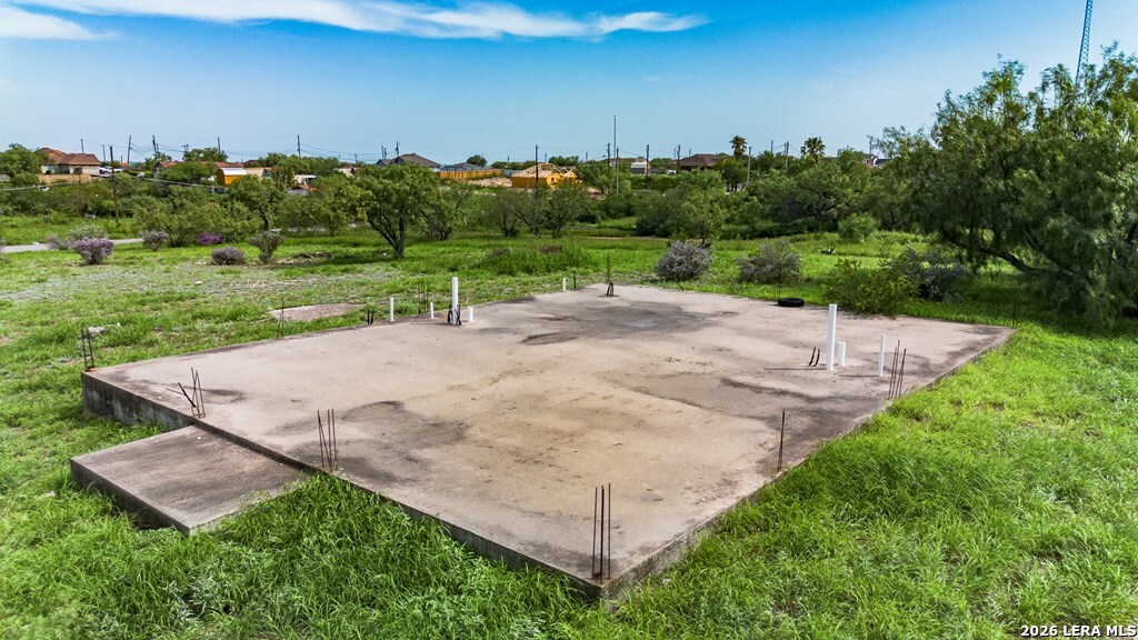 1326 Wagon Wheel Road Eagle Pass, TX 78852 - Photo 15 of 17 an aerial view of a house with yard and trees in the background