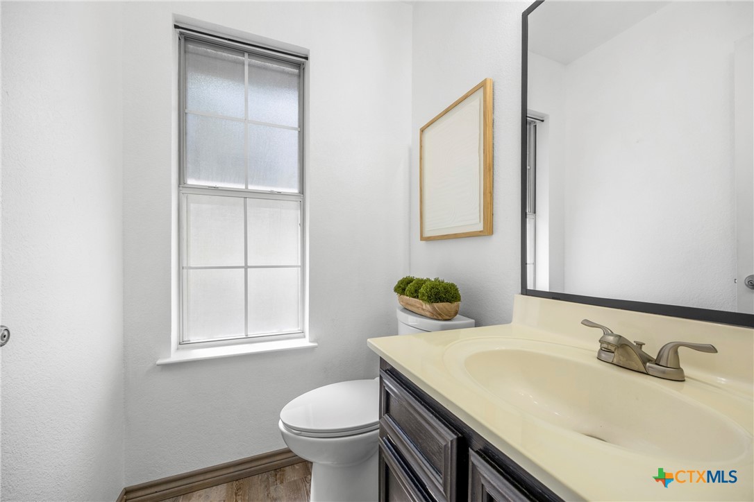 5107 Denmans Loop Belton, TX 76513 - Photo 20 of 48 a bathroom with a sink toilet and vanity