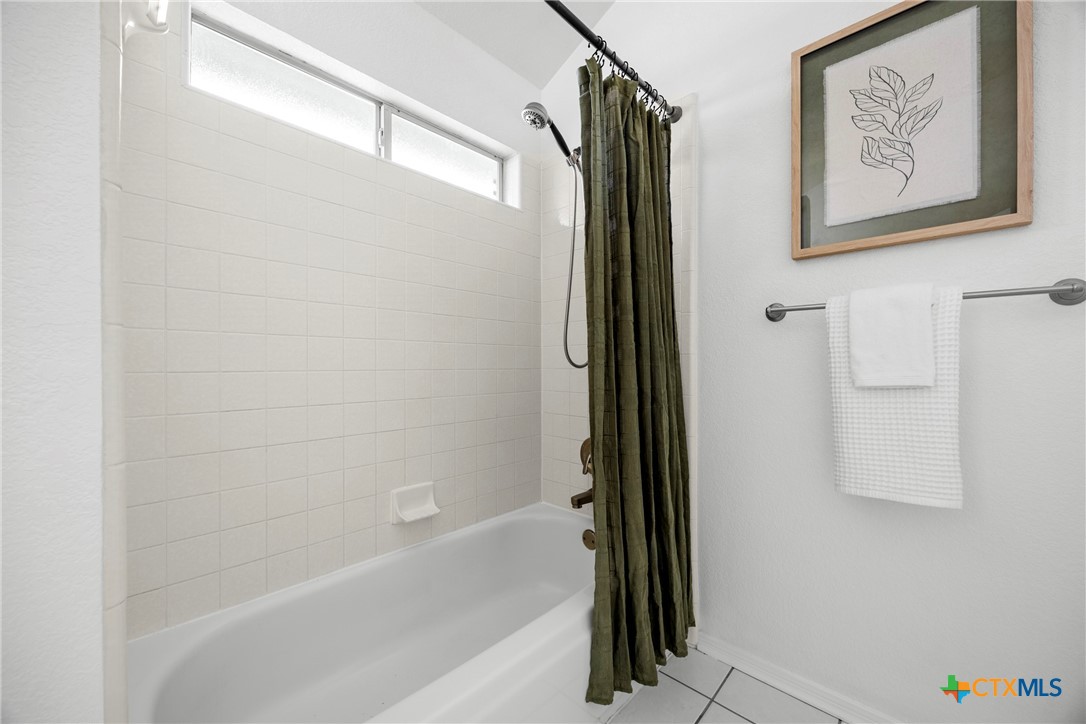 5107 Denmans Loop Belton, TX 76513 - Photo 25 of 48 a bathroom with a shower and a tub