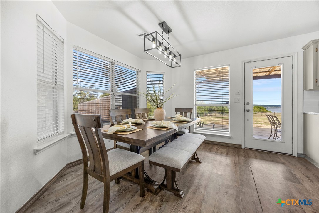5107 Denmans Loop Belton, TX 76513 - Photo 8 of 48 a view of a dining room with furniture window and wooden floor