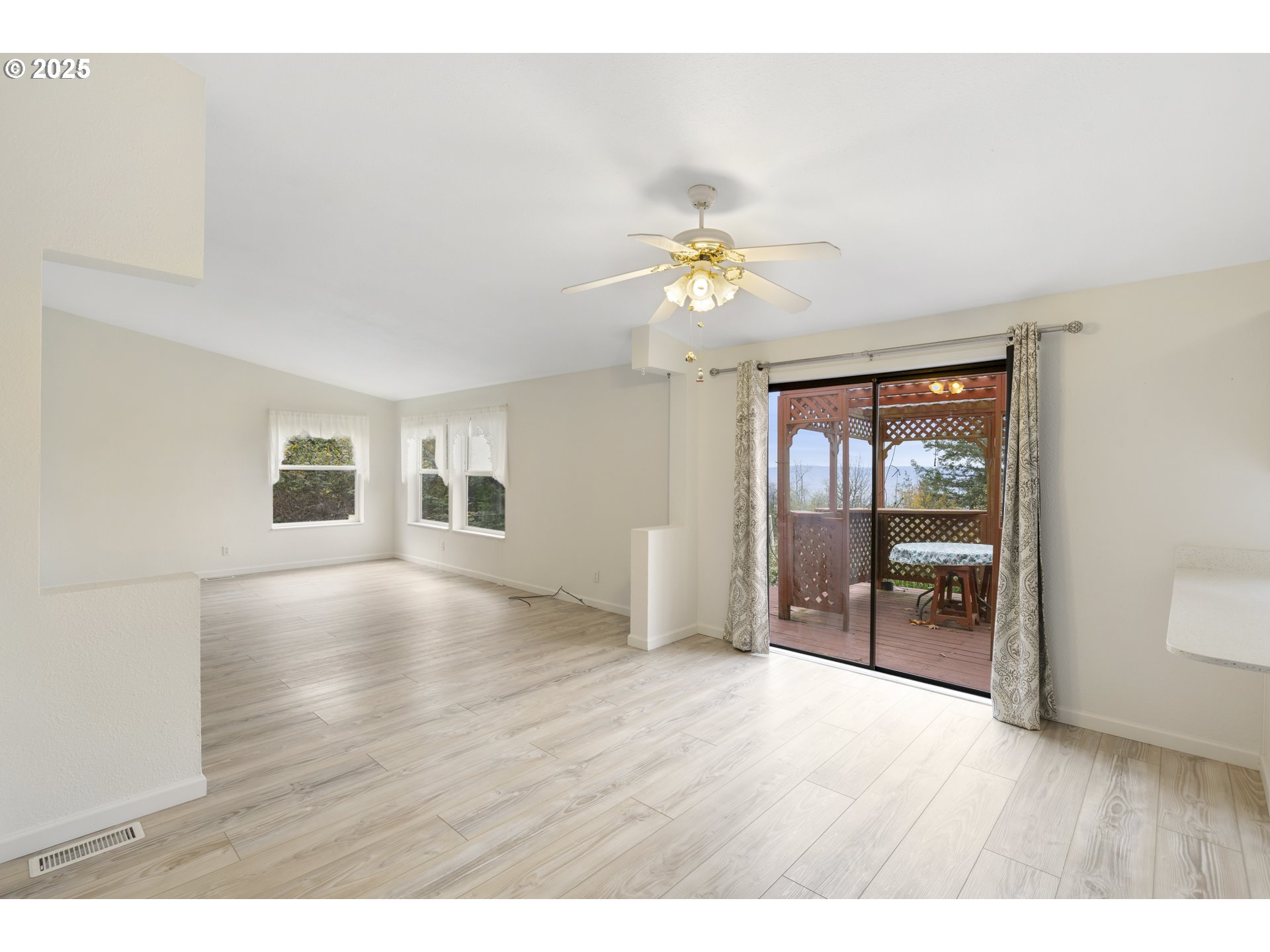 1115 China Garden Road Kalama, WA 98625 - Photo 12 of 40 a view of an empty room with a window and wooden floor