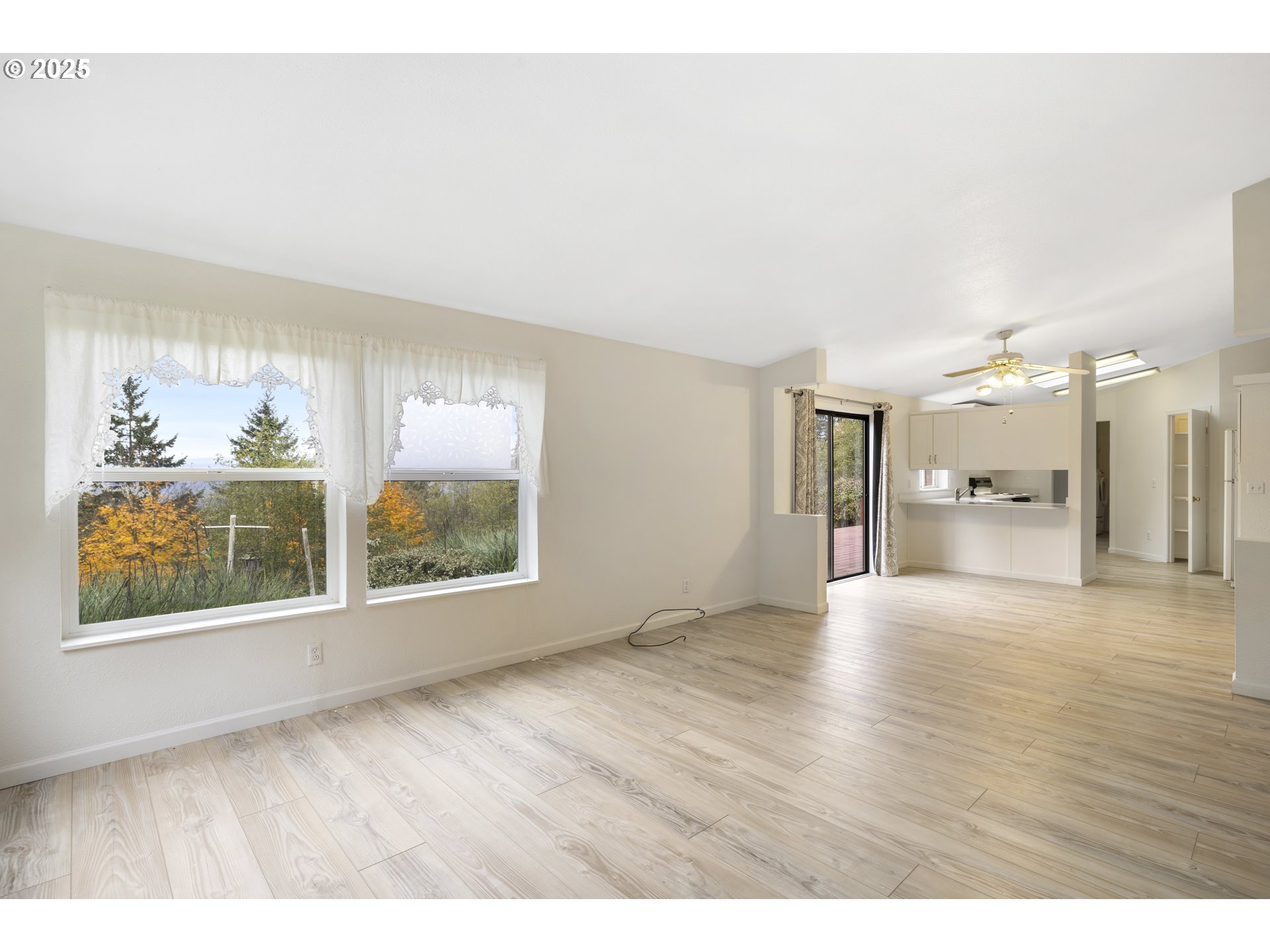 1115 China Garden Road Kalama, WA 98625 - Photo 14 of 40 a view of an empty room with a window and wooden floor