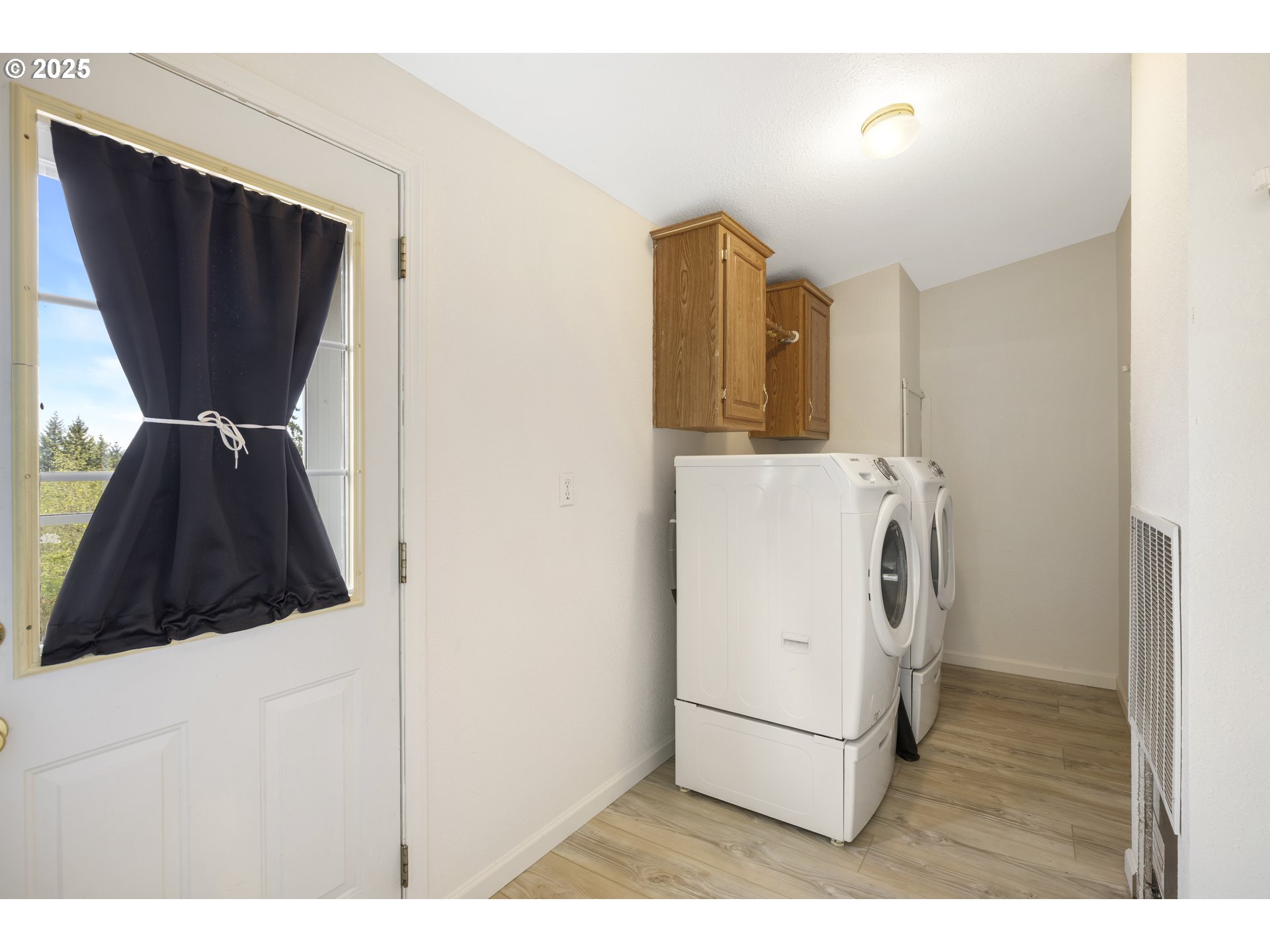 1115 China Garden Road Kalama, WA 98625 - Photo 23 of 40 a kitchen with a refrigerator and washer