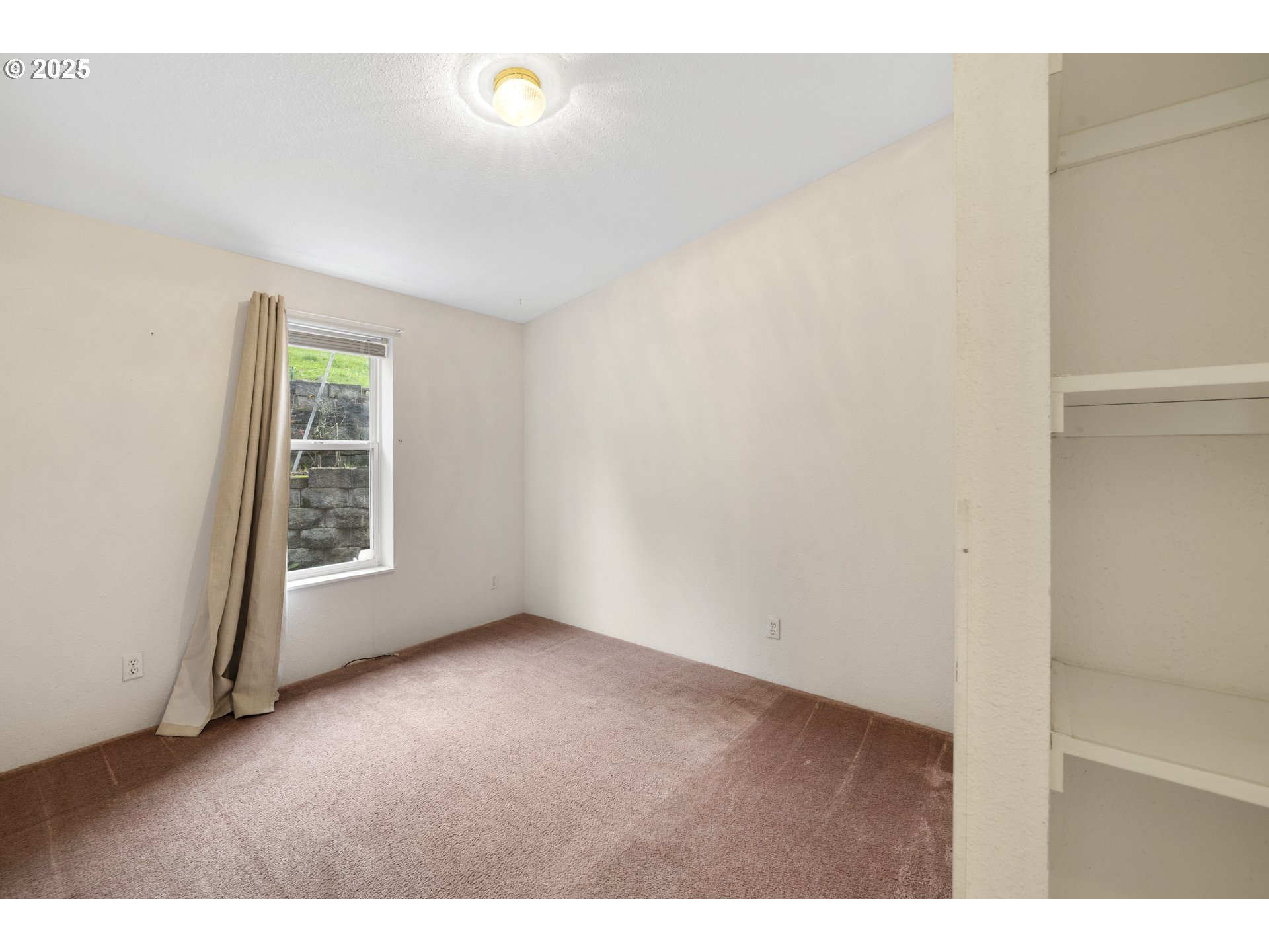 1115 China Garden Road Kalama, WA 98625 - Photo 25 of 40 a view of an empty room with a window