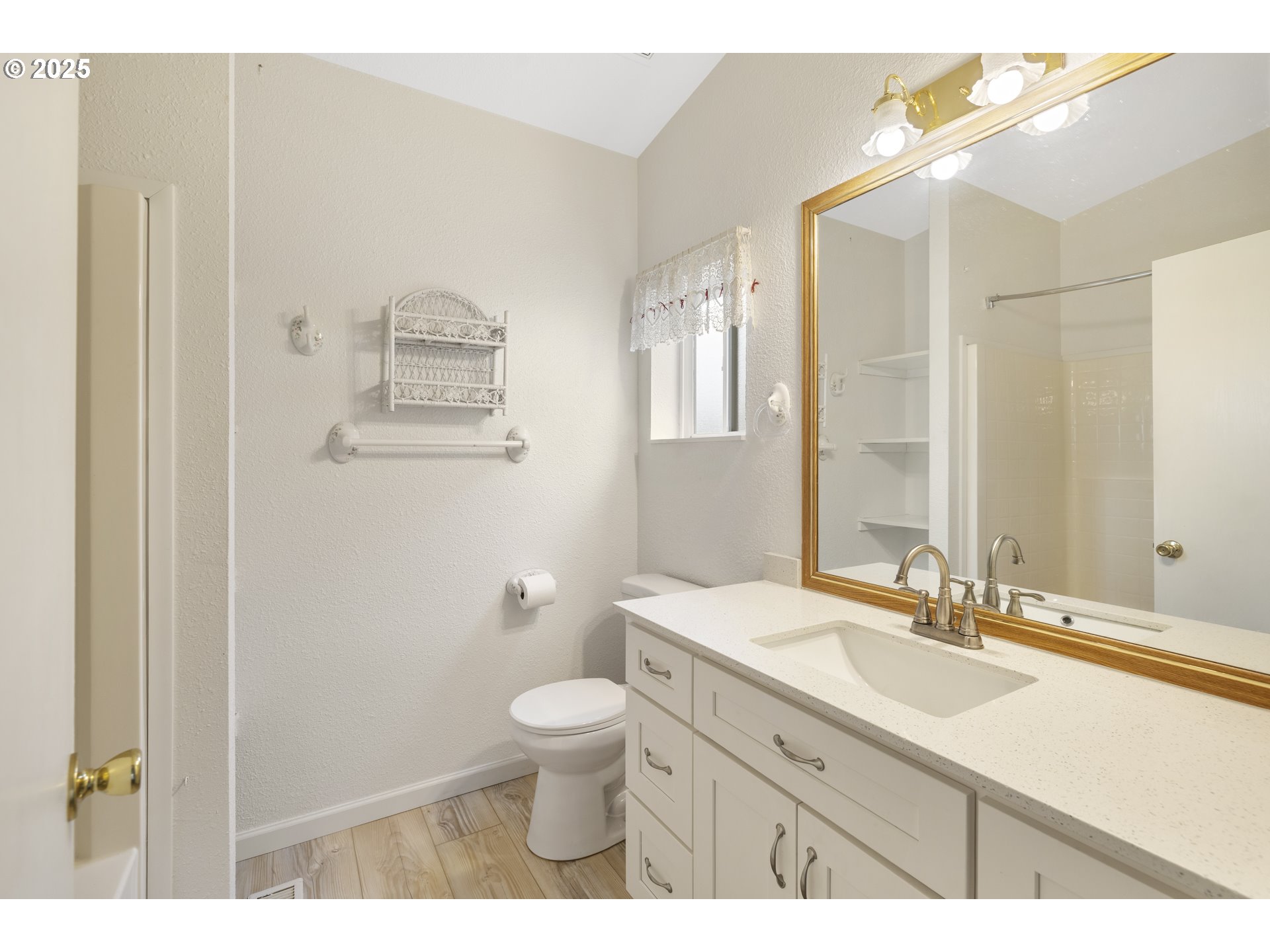 1115 China Garden Road Kalama, WA 98625 - Photo 31 of 40 a bathroom with a granite countertop sink a toilet and a mirror