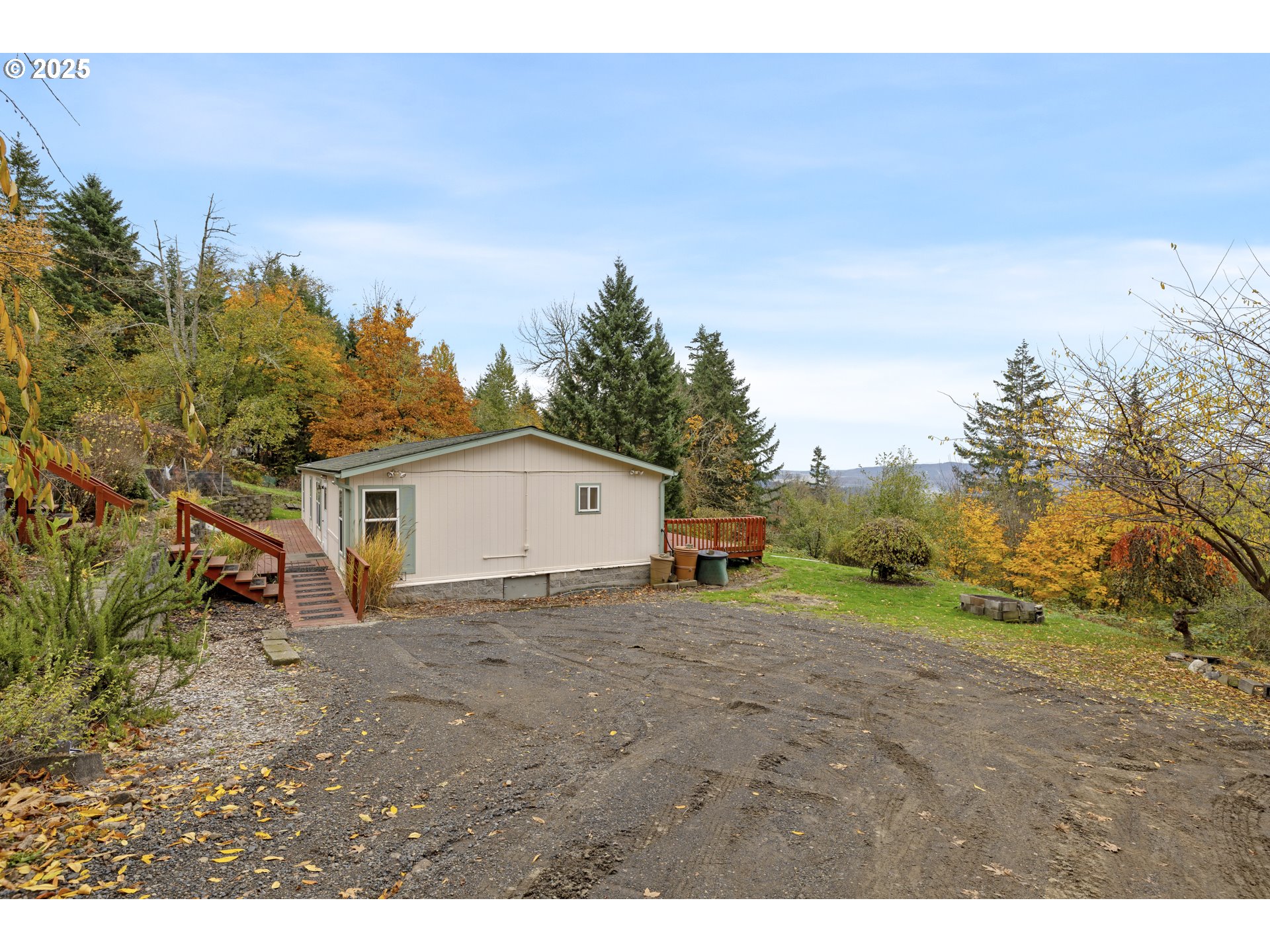 1115 China Garden Road Kalama, WA 98625 - Photo 4 of 40 a view of a house with a yard and large tree