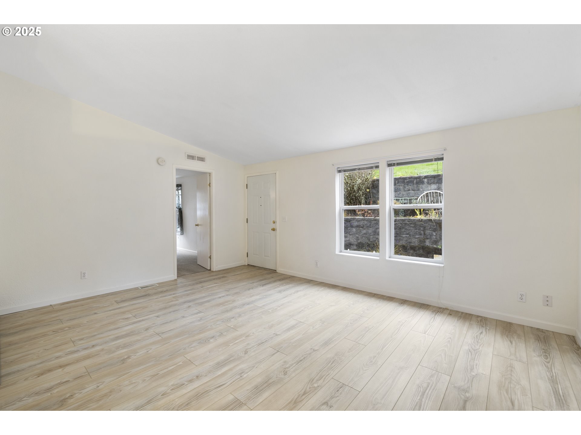 1115 China Garden Road Kalama, WA 98625 - Photo 10 of 40 an empty room with wooden floor and windows